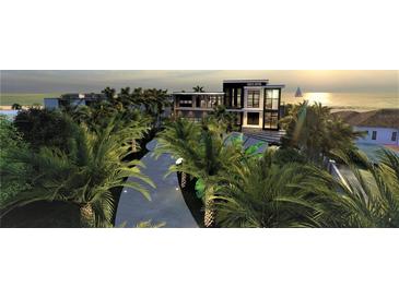 Luxury waterfront home with a modern design, showcasing a stunning sunset view at 639 Cornwell On The Gulf, Venice, FL 34285