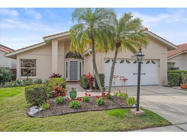 Well-maintained house with attractive landscaping and a two-car garage at 4327 Marcott Cir, Sarasota, FL 34233