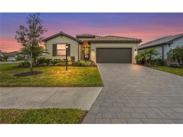 Charming single-story home with a well-manicured lawn and a two-car garage, perfect for suburban living at 5107 Coral Reef Way, Bradenton, FL 34211