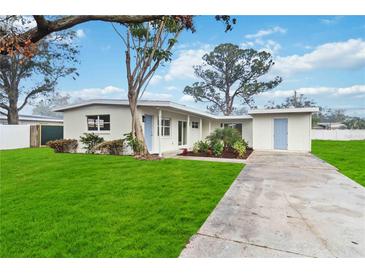 Newly renovated home with a well-manicured lawn and driveway at 2108 30Th W Ave, Bradenton, FL 34205