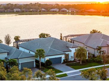 Luxury homes with lake views at sunset at 788 Sigsbee Loop, Sarasota, FL 34240