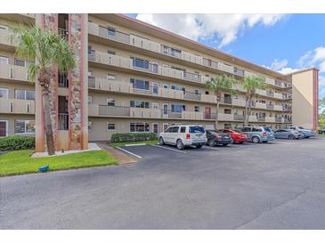 Building exterior showcasing ample parking and a well-maintained property at 4460 Ironwood Cir # 403A, Bradenton, FL 34209