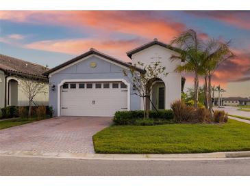 Curb appeal abounds at this charming one-story home, showcasing a two-car garage at 1901 6Th E St, Palmetto, FL 34221