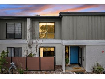 Charming townhome with a blue front door and neat landscaping at 4001 Beneva Rd # 304, Sarasota, FL 34233
