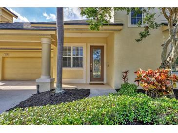 Charming home featuring a beautiful front door, lush landscaping, and a welcoming entrance at 4708 Clipper Dr, Bradenton, FL 34208