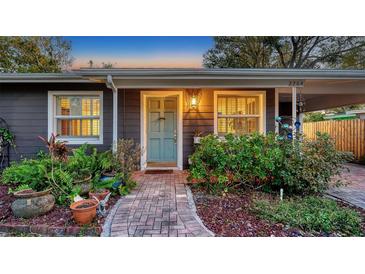 Charming home featuring a beautifully landscaped front yard and inviting front door at 2264 Floyd St, Sarasota, FL 34239