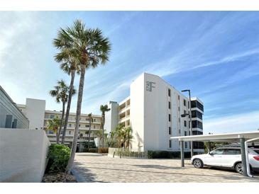 Condo building with tropical landscaping, convenient parking and a serene atmosphere at 5740 Midnight Pass Rd # 307, Sarasota, FL 34242