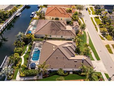 Stunning waterfront homes featuring private pools and lush landscaping with direct canal access at 579 Fore Dr, Bradenton, FL 34208