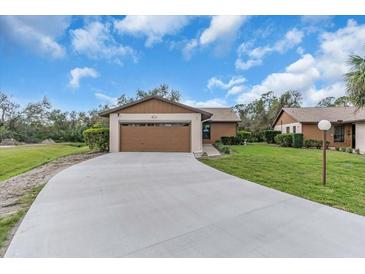 Charming single-story home featuring an attached two car garage, and a spacious driveway at 1817 Curry Ave # 57, Nokomis, FL 34275