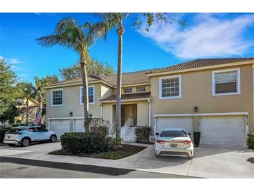 Inviting townhome with attached garage and beautiful tropical landscaping, perfect for low-maintenance living at 6706 Fairway Gardens Dr # 6706, Bradenton, FL 34203