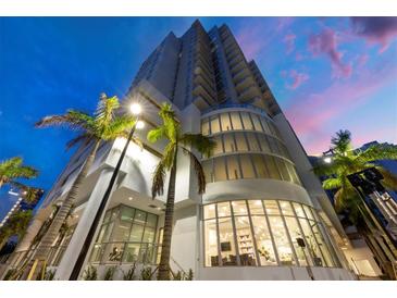 Modern high-rise condo building featuring contemporary architecture, sleek lines, and expansive glass windows and balconies at 301 Quay Commons # 1411, Sarasota, FL 34236