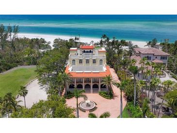 Stunning beachfront mansion with well-manicured landscaping and beautiful ocean views at 1067 Westway Dr, Sarasota, FL 34236
