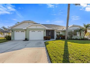 Charming one-story home with attached two-car garage and well-manicured lawn at 1209 89Th Nw St, Bradenton, FL 34209