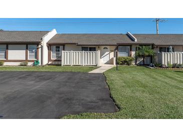 Charming townhome featuring a well-maintained lawn and paved driveway at 3403 36Th W St # 109, Bradenton, FL 34205