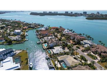 Stunning aerial view of waterfront homes with private docks, and lush tropical landscaping in a beautiful neighborhood at 355 W Royal Flamingo Dr, Sarasota, FL 34236