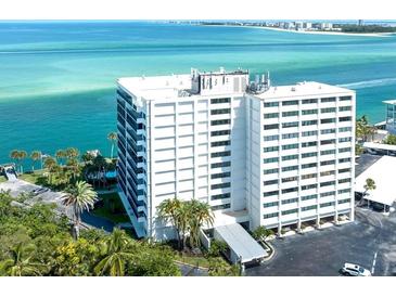 Stunning waterfront condo building boasting panoramic ocean views and lush landscaping at 4822 Ocean Blvd # 2D, Sarasota, FL 34242