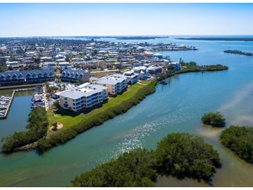 Beautiful aerial view of waterfront condos and community overlooking the scenic bay at 2424 Placida Rd # C104, Englewood, FL 34224
