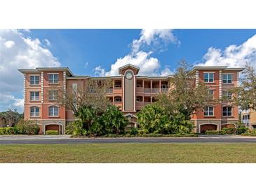 Exterior view of the charming condo complex featuring lush landscaping and a well-maintained facade at 5246 Manorwood Dr # 4, Sarasota, FL 34235