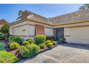 Charming one-story home with well-maintained landscaping, neutral tones, and a lovely tile roof at 3522 57Th Avenue W Cir, Bradenton, FL 34210