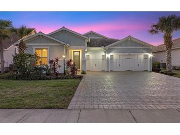 Charming single-story home with a three-car garage and well-maintained landscaping at 3375 Chestertown Loop, Lakewood Ranch, FL 34211