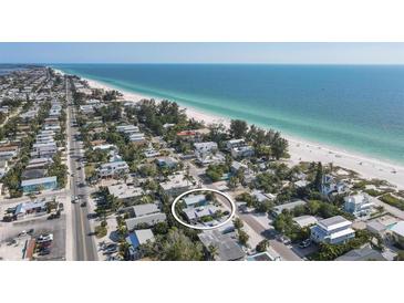 Beautiful beach home and coastline view with turquoise ocean water at 3007 Avenue E # A, Holmes Beach, FL 34217