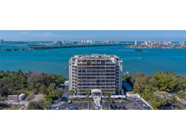 Modern condo with large windows overlooking the bay, city, and lush greenery at 500 N Osceola Ave # 203, Clearwater, FL 33755