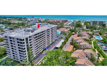 High-rise condo with bay views offers luxurious coastal living, with nearby amenities at 6415 Midnight Pass Rd # 211, Sarasota, FL 34242