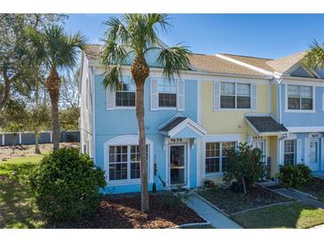 Charming townhome showcasing colorful exteriors, lush landscaping, and inviting curb appeal at 4658 Sabal Key Dr, Bradenton, FL 34203