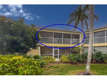 Condo with large screened lanai overlooking lush tropical landscaping and palm trees at 6101 34Th W St # 33D, Bradenton, FL 34210