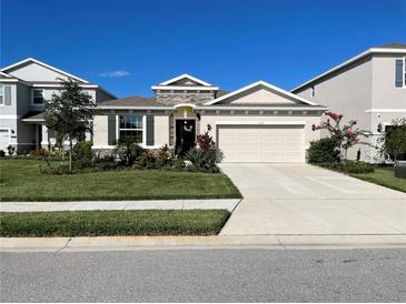 Charming single-story home with a two-car garage, lovely landscaping and stone accents at 5313 Halewood Ct, Bradenton, FL 34211