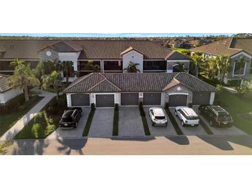 Beautiful townhomes with private garages and well-maintained landscaping at 5527 Palmer Cir # 105, Bradenton, FL 34211