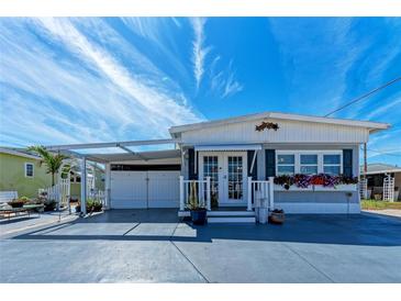Charming single-story home with well-maintained landscaping, covered parking and appealing curb appeal at 10315 Cortez W Rd # 17F, Bradenton, FL 34210