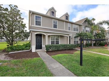 Charming two-story home with well-manicured lawn and inviting front entrance at 8850 Christie Dr, Largo, FL 33771