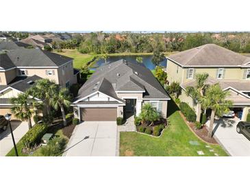 Beautiful single Gathering home with mature landscaping and a lovely water view at 6161 Anise Dr, Sarasota, FL 34238