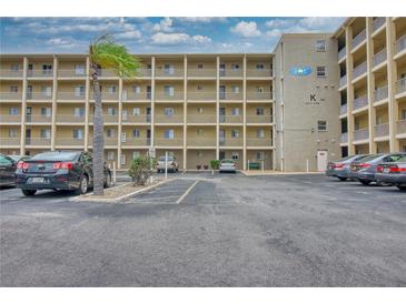 Multi-story condo building with ample parking and view of balconies at 3658 Lake Bayshore Dr # 320, Bradenton, FL 34205