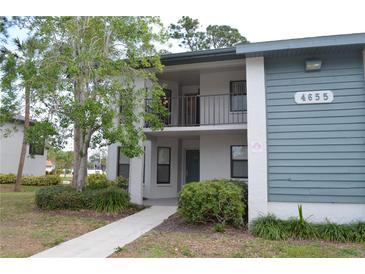 Inviting condo building featuring a mix of neutral and blue siding with a charming balcony at 4655 46Th Street W Ct # 201, Bradenton, FL 34210