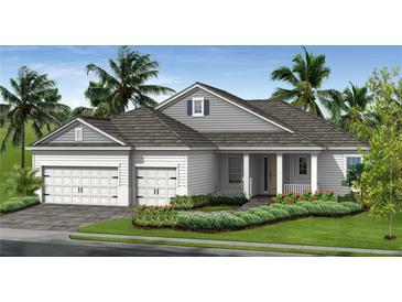 Charming one-story home featuring a two-car garage, covered entry, and beautifully landscaped front yard at 11077 Hogan Cir, Englewood, FL 34223