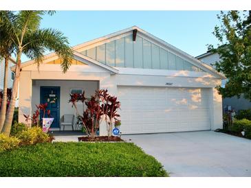 Charming single-Gathering home boasts a two-car garage and manicured front yard at 14607 Brumby Ridge Ave, Lithia, FL 33547