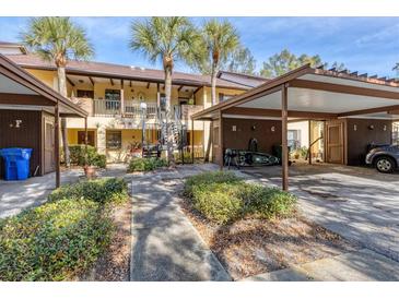 Charming condo with covered parking, lush landscaping, and inviting walkways at 4414 Spicewood Dr # H, Bradenton, FL 34208