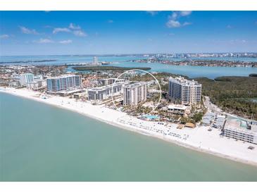 Breathtaking aerial view of beachfront condos, white sand beaches, and the sparkling Gulf coast at 1212 Benjamin Franklin Dr # 1103, Sarasota, FL 34236