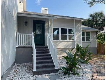 Charming front entrance with a well-maintained yard and inviting curb appeal at 4868 Featherbed Ln, Sarasota, FL 34242