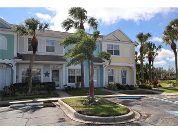 Charming townhomes with palm trees and well-maintained landscaping in a vibrant community at 5072 Misty Canal Pl, Bradenton, FL 34203