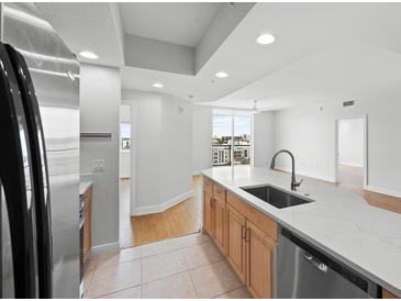 Modern kitchen features stainless steel appliances, granite countertops, and a spacious open layout at 800 N Tamiami Trl # 810, Sarasota, FL 34236