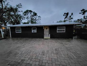 Charming home featuring simple architecture and a welcoming front door, enhanced by a paved driveway at 503 Olive Ave, Nokomis, FL 34275