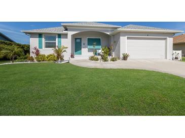 Charming single-Gathering home with a well-manicured lawn and inviting curb appeal at 6 Bunker Cir, Rotonda West, FL 33947