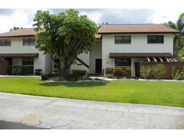 Well-maintained condo with manicured lawn and mature landscaping, offering great curb appeal at 6042 Red Maple Rd # 1001, Bradenton, FL 34210