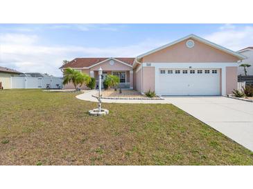 Charming single Gathering home featuring a two-car garage, well maintained lawn and mature landscaping at 9408 69Th E Ave, Palmetto, FL 34221