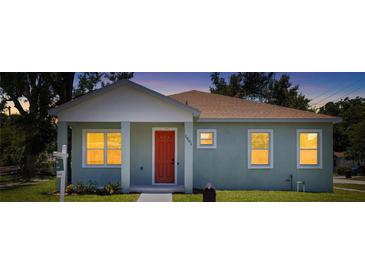 Charming single-story home boasts a well-maintained lawn, neutral paint, and inviting front porch at 1301 12Th S St, St Petersburg, FL 33705