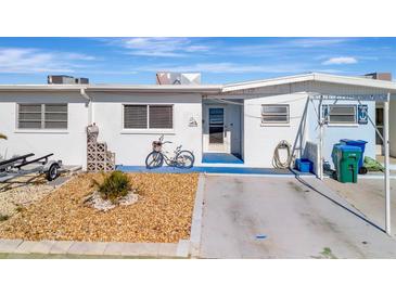 Charming single-story home with a well-maintained yard and a cozy, welcoming entrance at 15 Seaside Ct, Holmes Beach, FL 34217