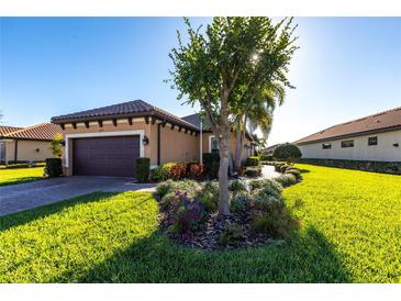 Charming home with a well-manicured lawn and lovely landscaping, enhancing its curb appeal at 4617 Alexandria Ct, Palmetto, FL 34221